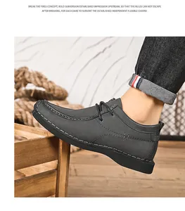 Gedetailleerd zijaanzicht van donkergrijze lederen liftschoenen voor heren met stiksels