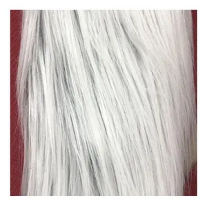 Close-up detail showing the soft long white faux fur of a Christmas plush decoration.