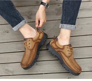 Close-up of men's breathable genuine leather casual outdoor shoes on wooden deck
