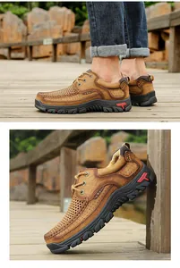 Detailed macro view of brown leather outdoor shoes featuring breathable perforated design.