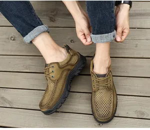Detailed view of men's brown genuine leather casual outdoor shoes with perforated design