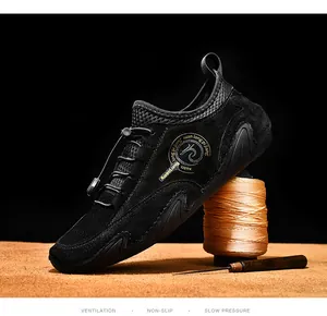 Detail of black breathable loafers with unique octopus-style sole and drawstring laces.