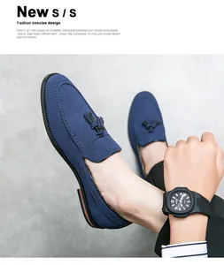 Close-up of blue suede loafers for men with decorative tassels and fine stitching