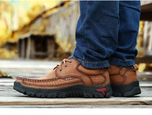 Side profile of men's brown genuine leather casual outdoor shoes with durable rubber sole
