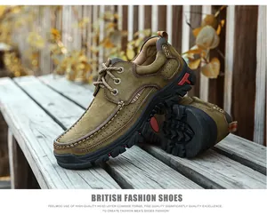 Side detail of durable brown cowhide leather outdoor shoes on a rustic wooden bench.