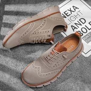Top view of beige flying woven casual shoes on a grey textured background with props