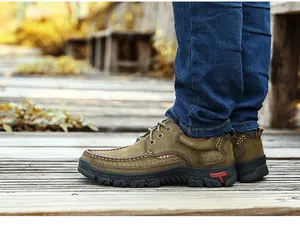 Side view of men's genuine leather outdoor shoes featuring rugged soles and stitching.