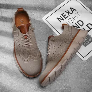 Detail view of breathable fly-weave casual shoes with brogue pattern and soft sole.