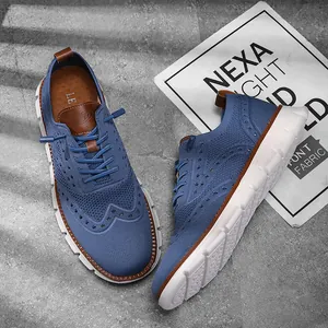 Close-up of blue breathable mesh casual shoes with brogue pattern design