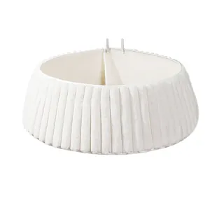 Detailed view of white pleated plush Christmas tree collar with soft faux fur texture.
