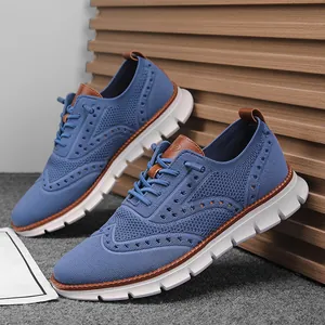 Blue knitted mesh sneakers with breathable brogue style perforations and soft white sole