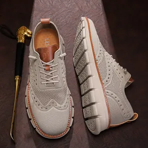 Detailed view of breathable beige fly-knit mesh casual shoes featuring classic brogue patterns.