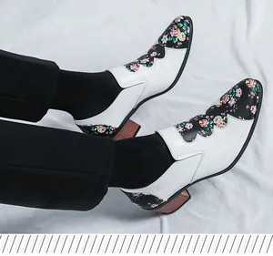 Detail of men's floral patchwork patent leather shoes with a wooden block heel