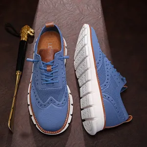 Blue breathable knit casual shoes with brogue details and thick white soft sole.
