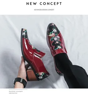 Macro view of men's burgundy patent leather shoes with floral patchwork and wood heel