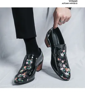Detail of floral patchwork patent leather men's dress shoes with wooden heel