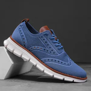 Side view of blue fly-knit casual sneaker featuring wingtip perforation and chunky white sole