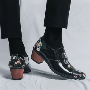 Men's stylish patent leather high-heeled shoes featuring floral stitching and wood grain heels