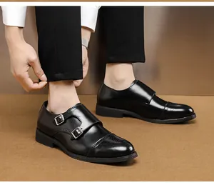 Classic black leather double monk strap shoes with pointed toe and brogue detail.