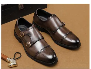 Elegant men's dark brown double monk strap leather shoes with brogue toe detailing.