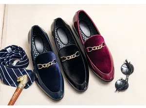 Detail view of men's slip-on loafers in three colors with gold chain accents