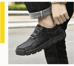 Detail view of men's black microfiber casual shoes with hand-stitched seams and laces.