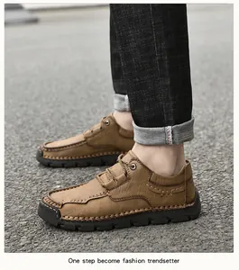 Detail view of men's brown microfiber casual shoes with manual stitching and laces.