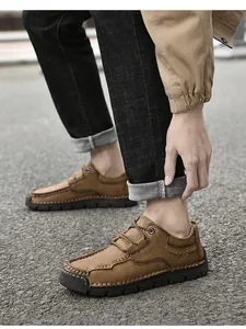 Detailed view of brown microfiber men's casual loafers featuring hand-stitched craft