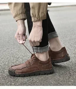 Detail of brown hand-stitched microfiber casual shoes for men being tied