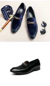 Detailed close-up of men's pointed-toe slip-on loafers with velvet and gold chain buckle