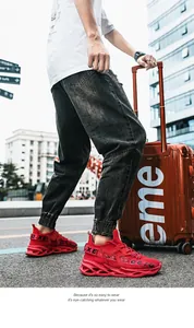 Lightweight red fly-knit blade running shoes for men featuring a unique blade sole design