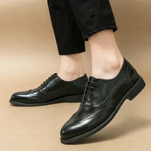 Elegant black men's brogue leather shoes for formal business or wedding wear.