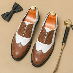 Elegant men's two-tone brown and white wingtip brogue dress shoes for business wedding