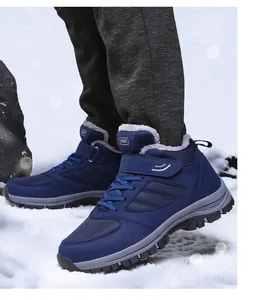 Detail view of navy blue winter snow boots with warm fleece lining and hook and loop strap