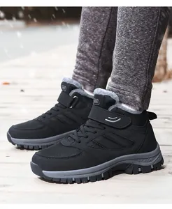 Lifestyle detail of black warm high-top winter sneakers with grey faux fur lining