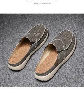Detail of men's canvas mule slippers with raw edges and comfortable cork-like insole.