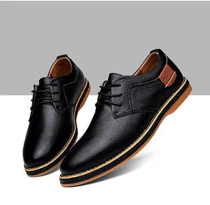 Detail of black pebbled leather men's business dress shoes with stylish lace-up design