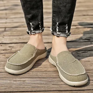 Men's breathable khaki canvas slip-on slippers with distressed edges outdoors.