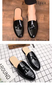 Detailed view of stylish men's black patent leather tassel loafers with slip-on design.