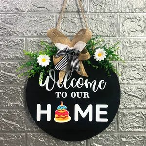 Rustic round wooden welcome to our home door sign with burlap bow and cake design