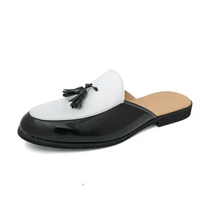 Men's stylish black and white patent leather tassel loafers mule on white background