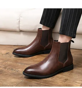 Detailed side view of classic brown leather Chelsea boots for men with elastic panels