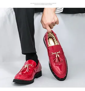 Men's glossy red patent leather loafers featuring decorative tassels and EVA foam sole