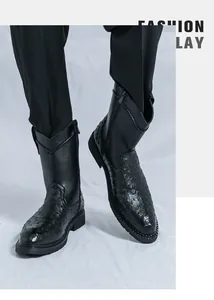 Detailed view of black men's cowboy boots featuring a unique ostrich skin texture