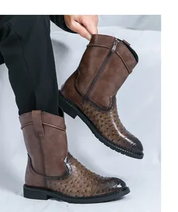 Macro view of brown vintage cowboy boots with ostrich pattern leather detail.