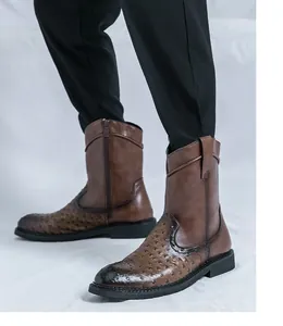 Detailed view of vintage men's pointed toe cowboy boots with faux ostrich leather texture