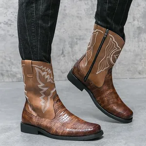 Westerse cowboylaarzen voor heren met krokodillenstructuur en geborduurde details.
