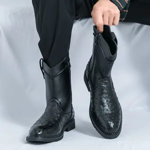 Vintage black men's cowboy boots featuring ostrich skin texture and sleek pointed toe