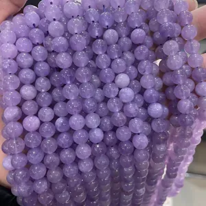 Macro view of purple lavender amethyst round loose beads with natural mineral texture