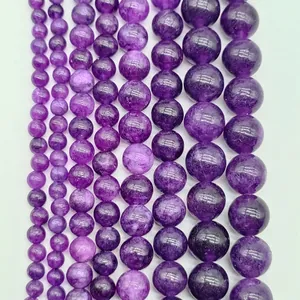Detailed macro view of high-quality polished lavender amethyst round beads in various sizes